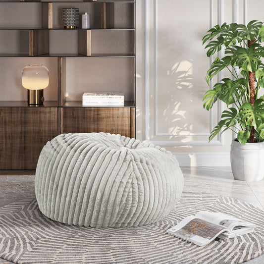 Plush ribbed light gray floor pouf for relaxed seating and decorative accents