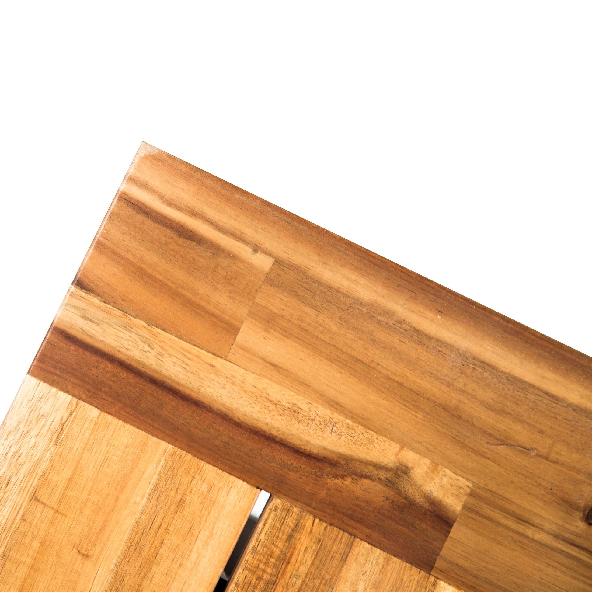Closeup of natural wood tabletop with visible grain patterns and warm tones