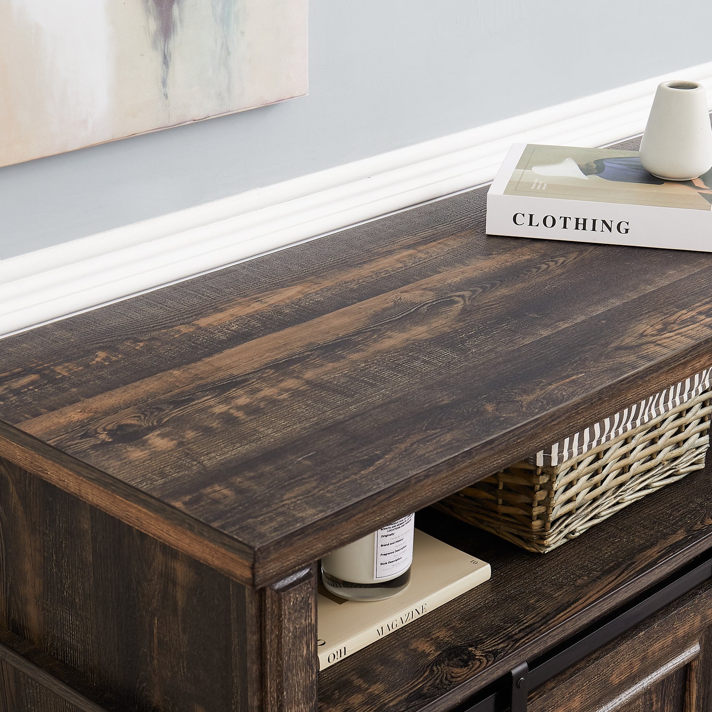 Dark wood media console with sliding barn door for TV room storage
