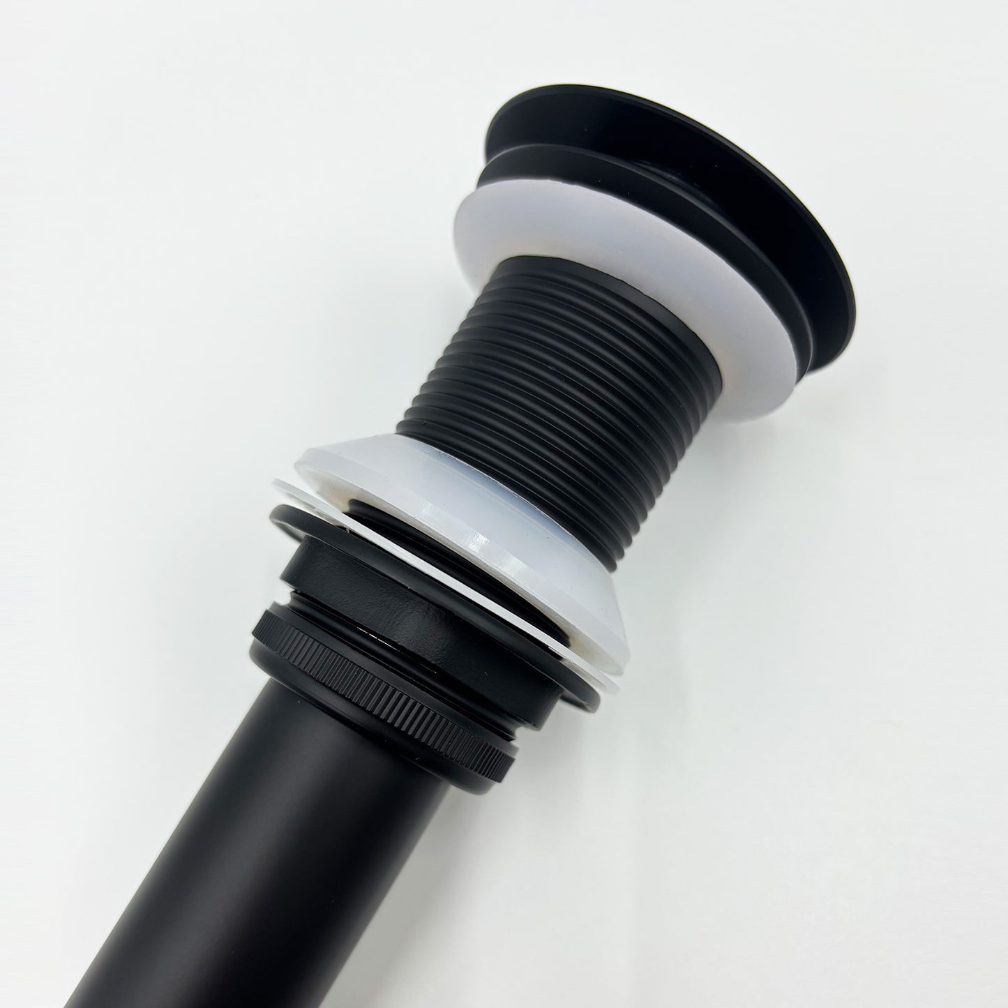 Black pop up drain for bathroom sinks features a sleek matte finish