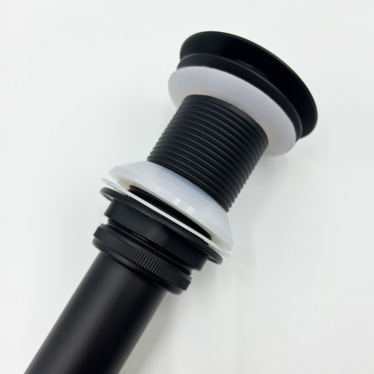 Black pop up drain for bathroom sinks features a sleek matte finish