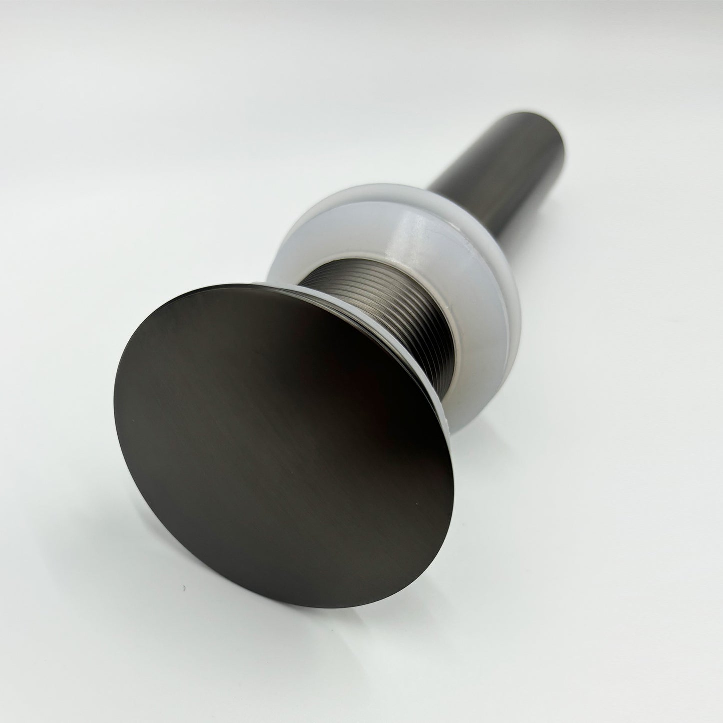 Matte black popup drain with brushed nickel finish for bathroom sinks