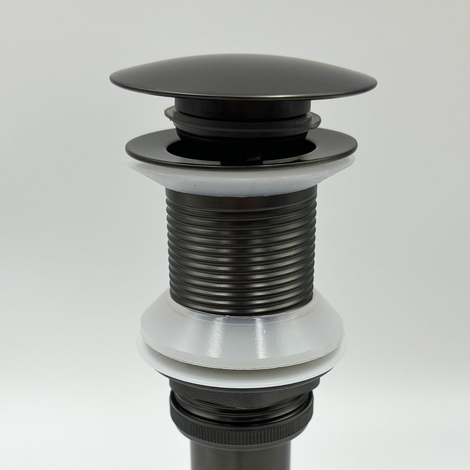 Black metal popup drain assembly with ribbed neck and white rubber seal