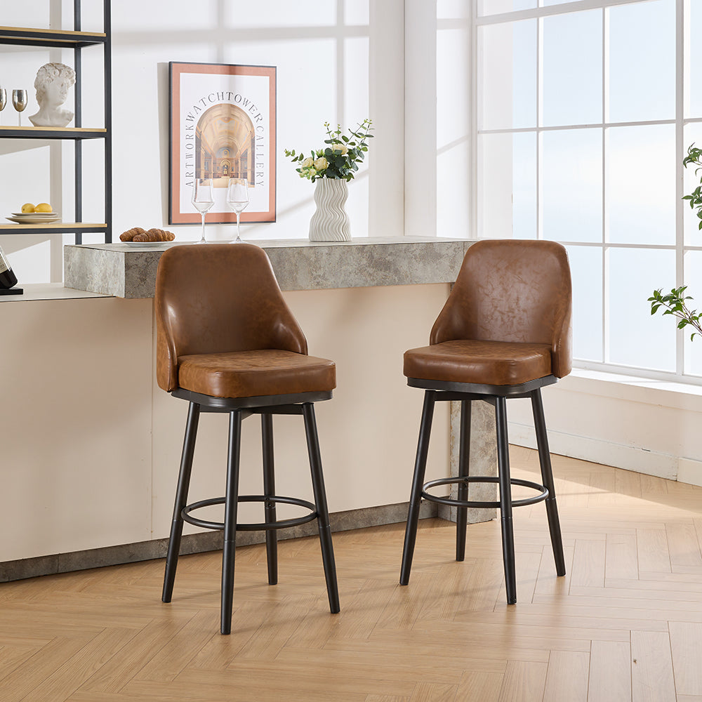 Two brown faux leather swivel bar stools with black metal legs and footrests