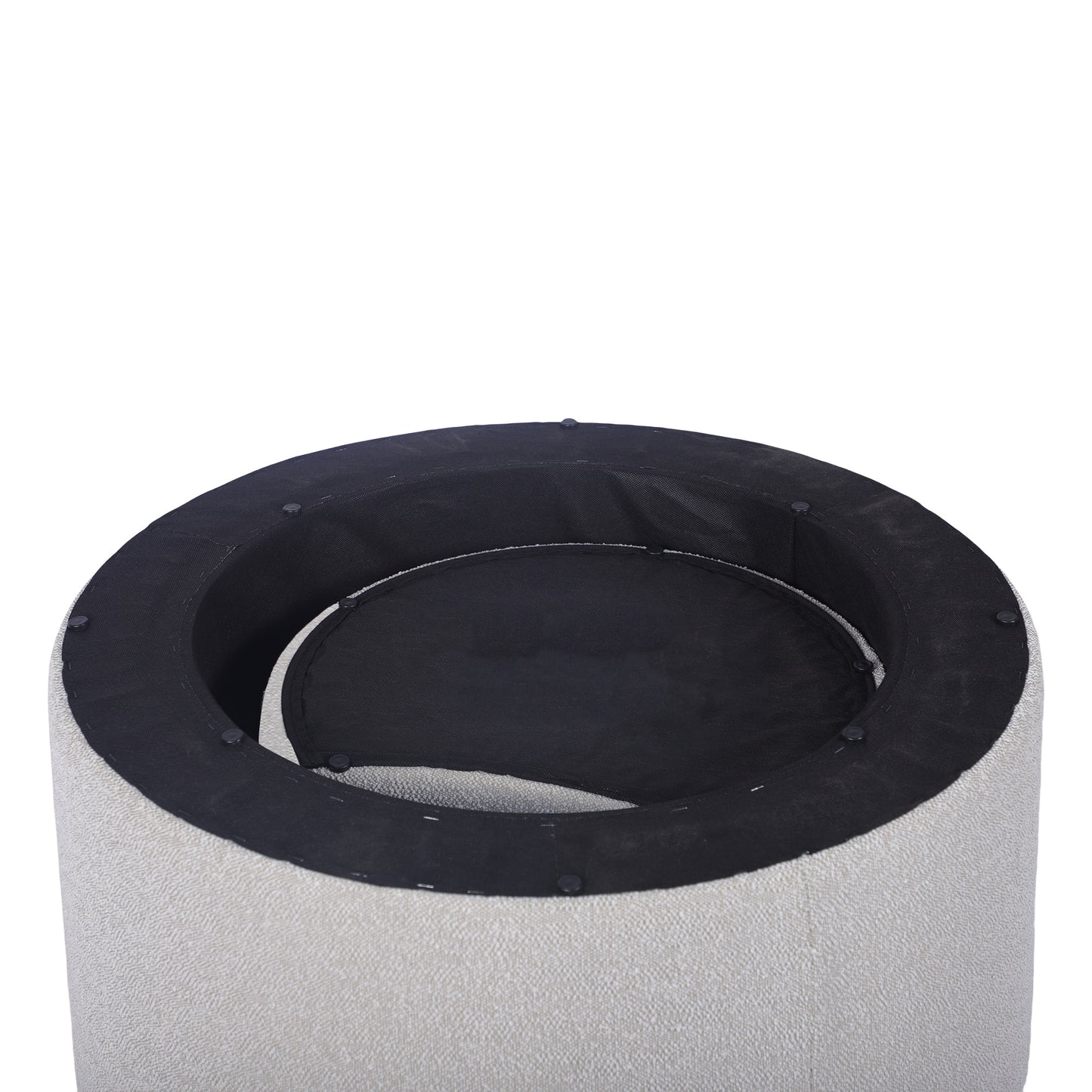 Closeup of a textured ivory fabric ottoman with black interior lining
