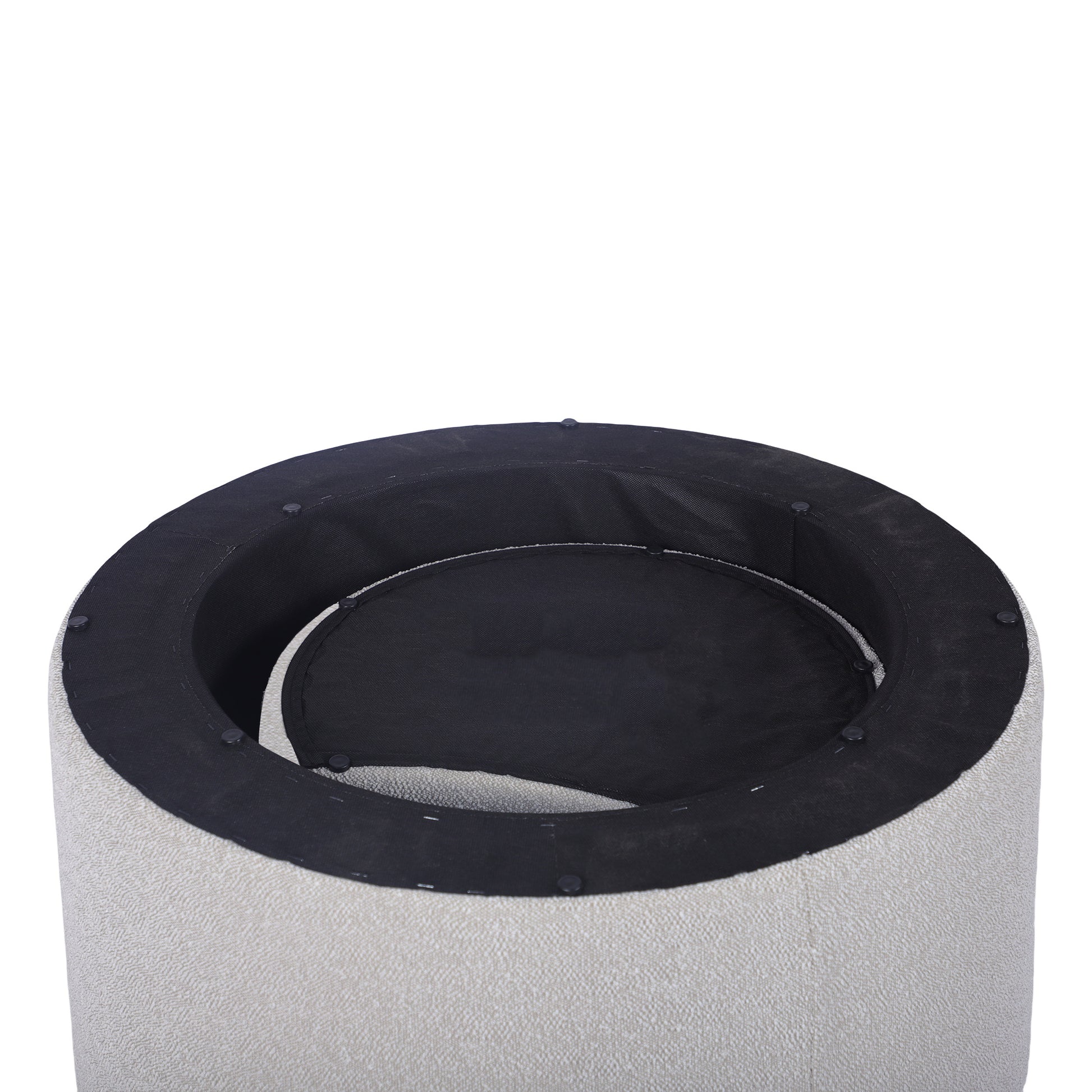 Closeup of a textured ivory fabric ottoman with black interior lining