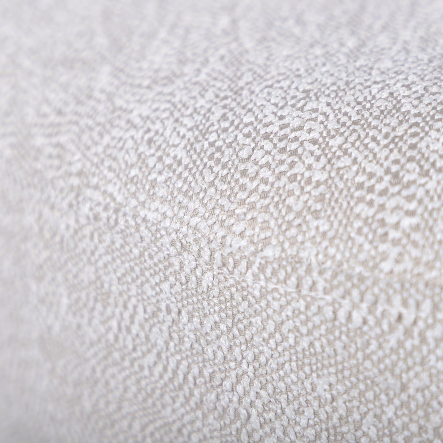 Closeup of textured beige chenille fabric ideal for upholstery and home decor