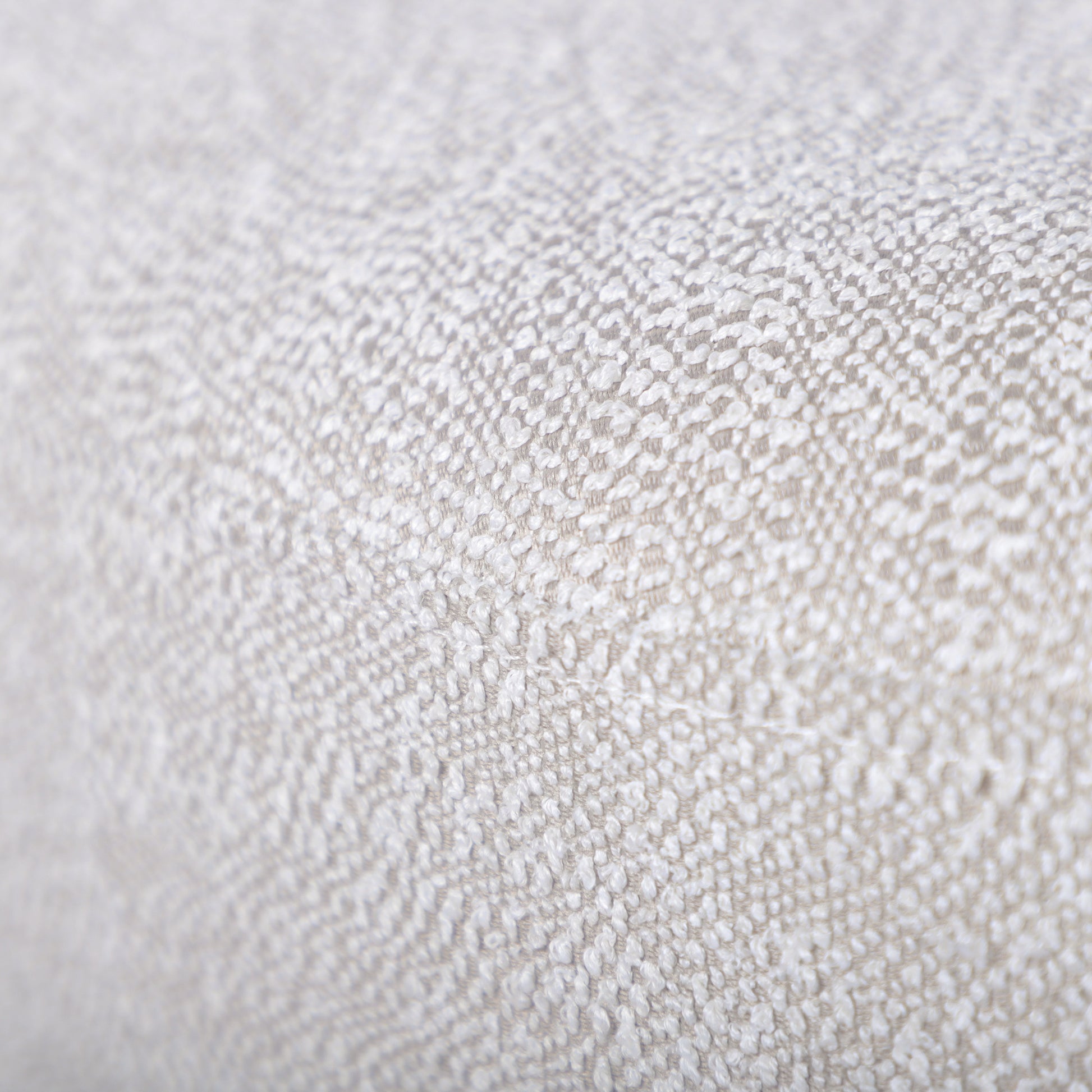 Closeup of textured beige chenille fabric ideal for upholstery and home decor