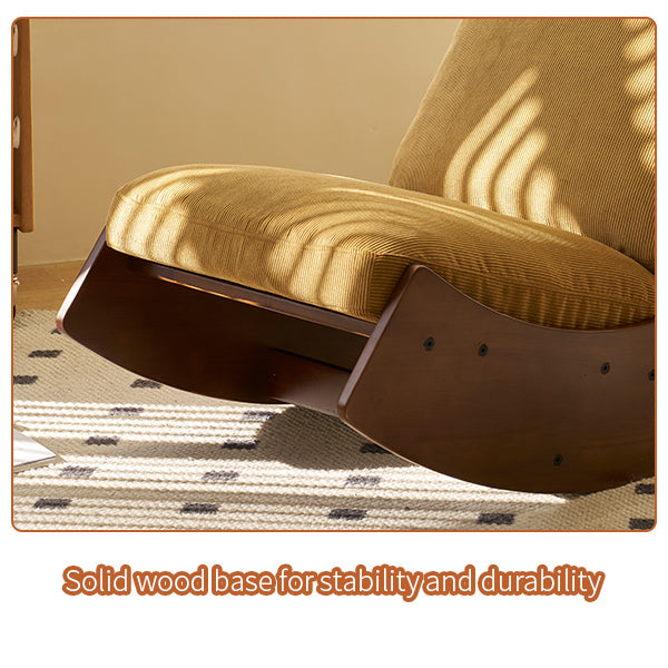 Dark wood curved base supporting a yellow corduroy upholstered rocking chair