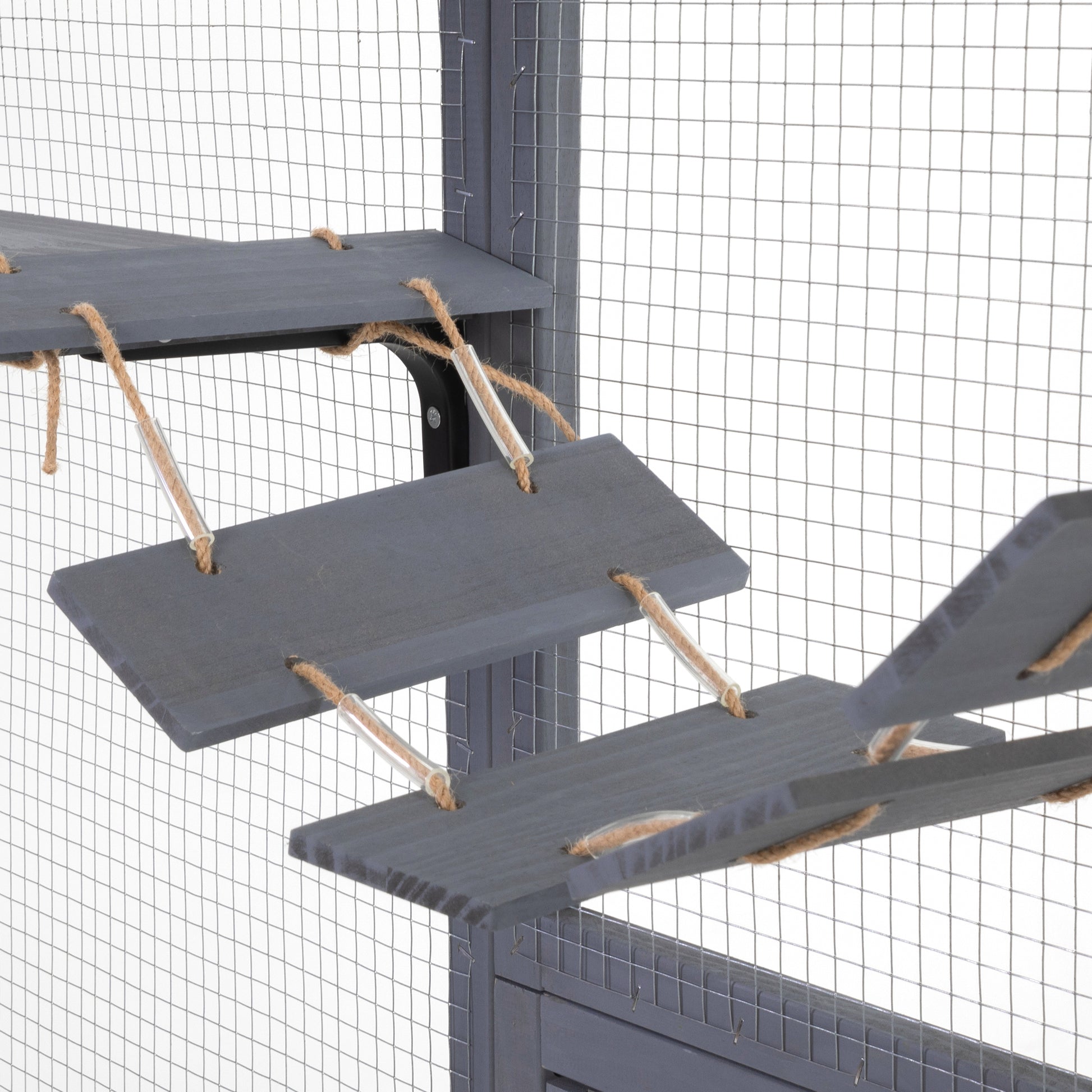 Wooden cat tree platforms with rope accents offering climbing opportunities