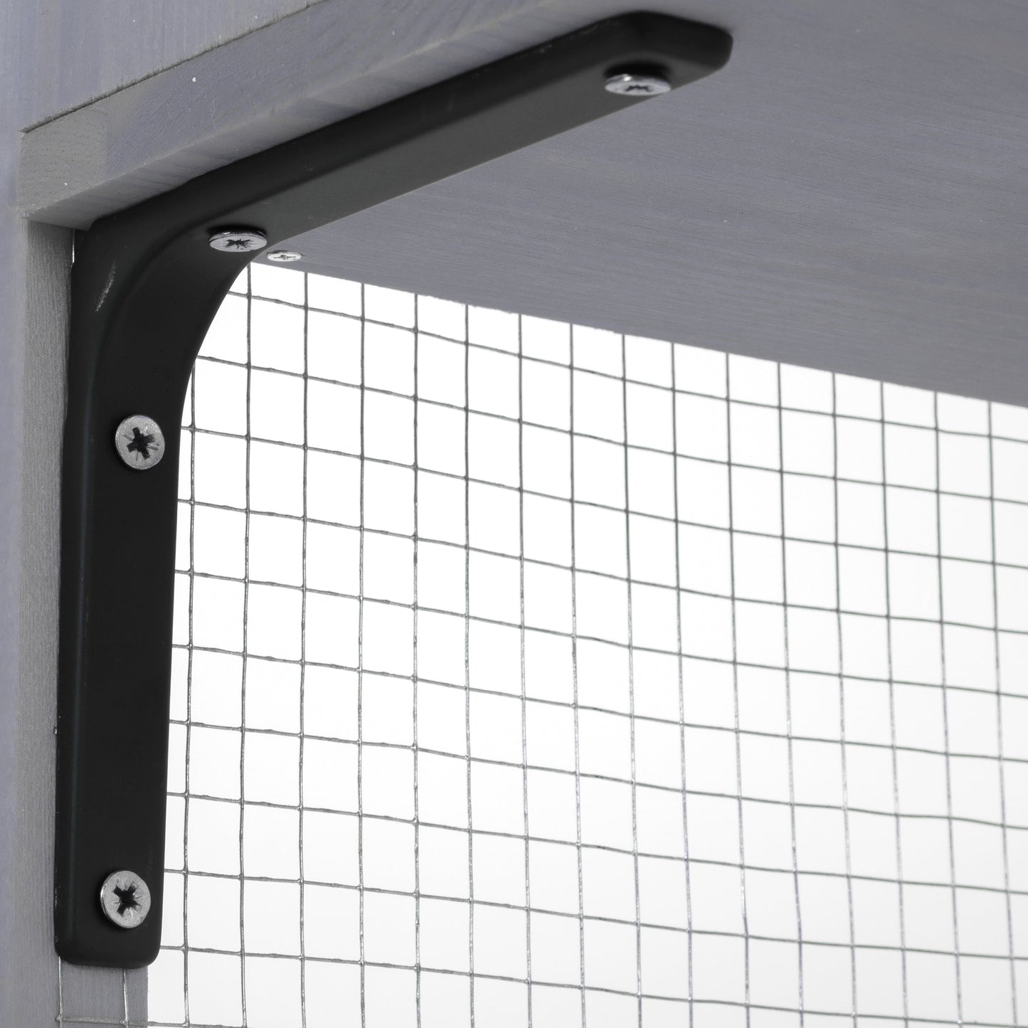 Black metal shelf bracket screwed into a grey wooden shelf and post