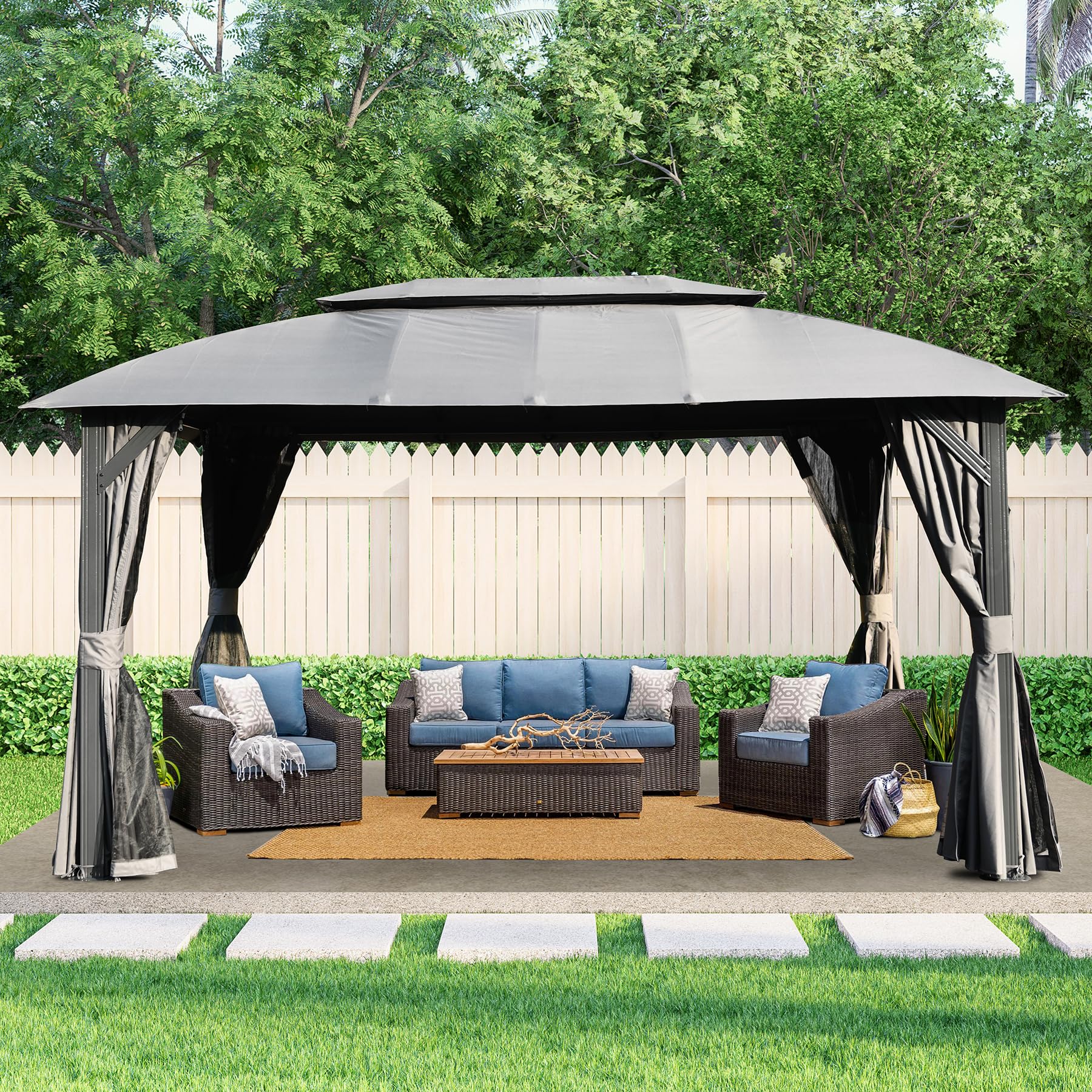 Gray patio gazebo with dark wicker furniture and blue cushions for outdoor entertaining