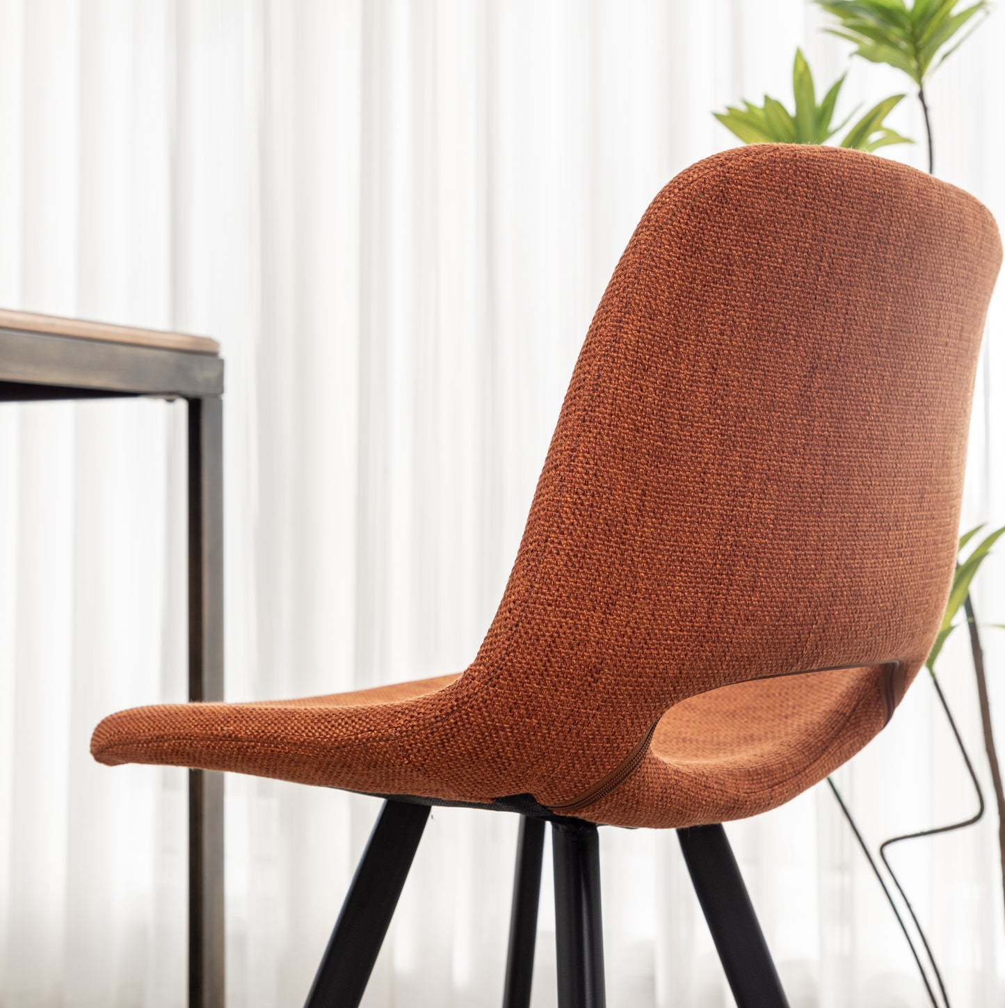 Orange textured fabric accent chair with black metal legs modern design