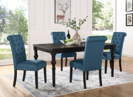 Dark wood dining table with tufted teal fabric chairs and decorative legs