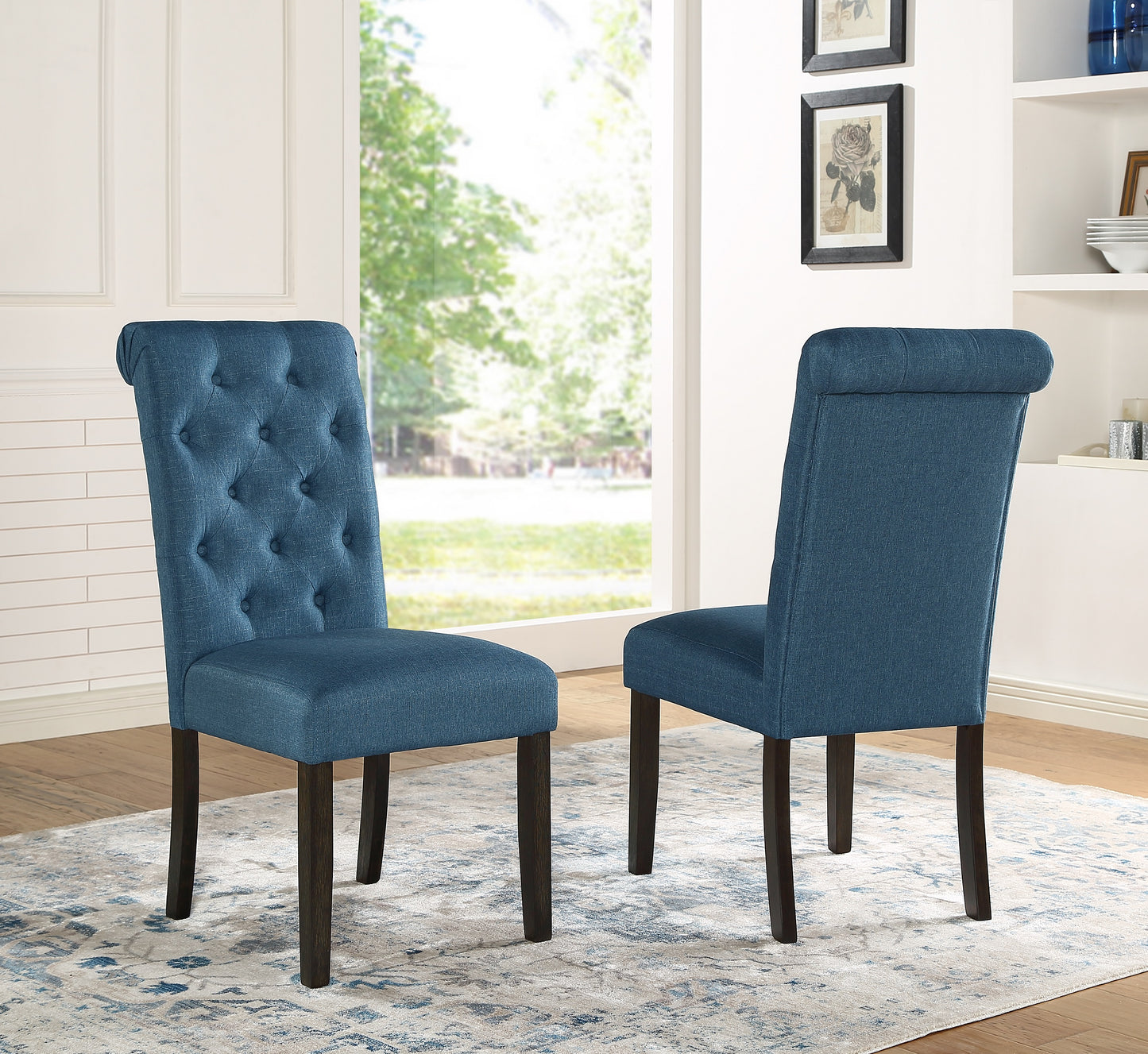 Tufted blue fabric dining chair with dark wood legs featuring a comfortable upholstered seat