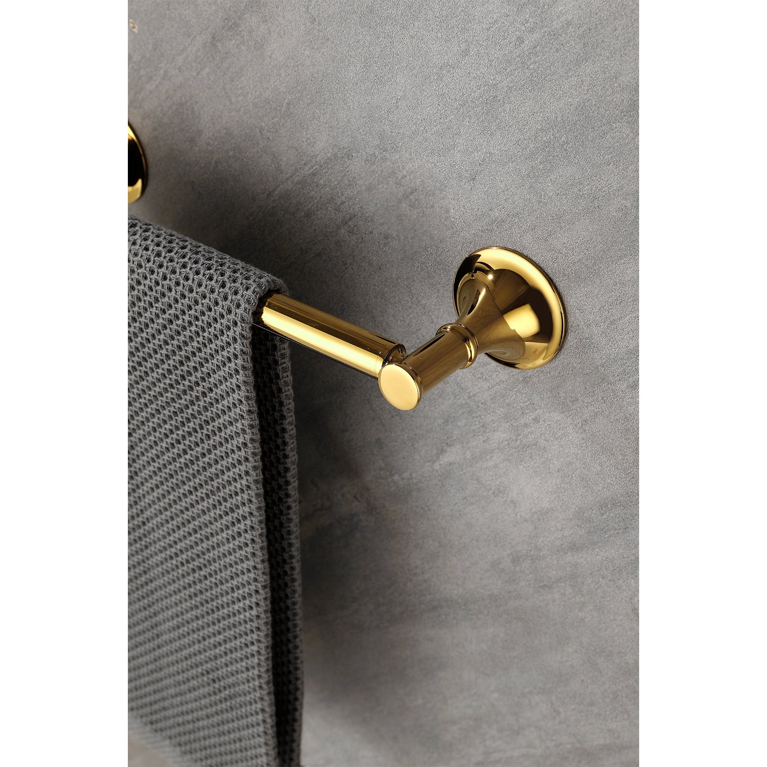 Polished brass towel bar with a grey waffleweave towel