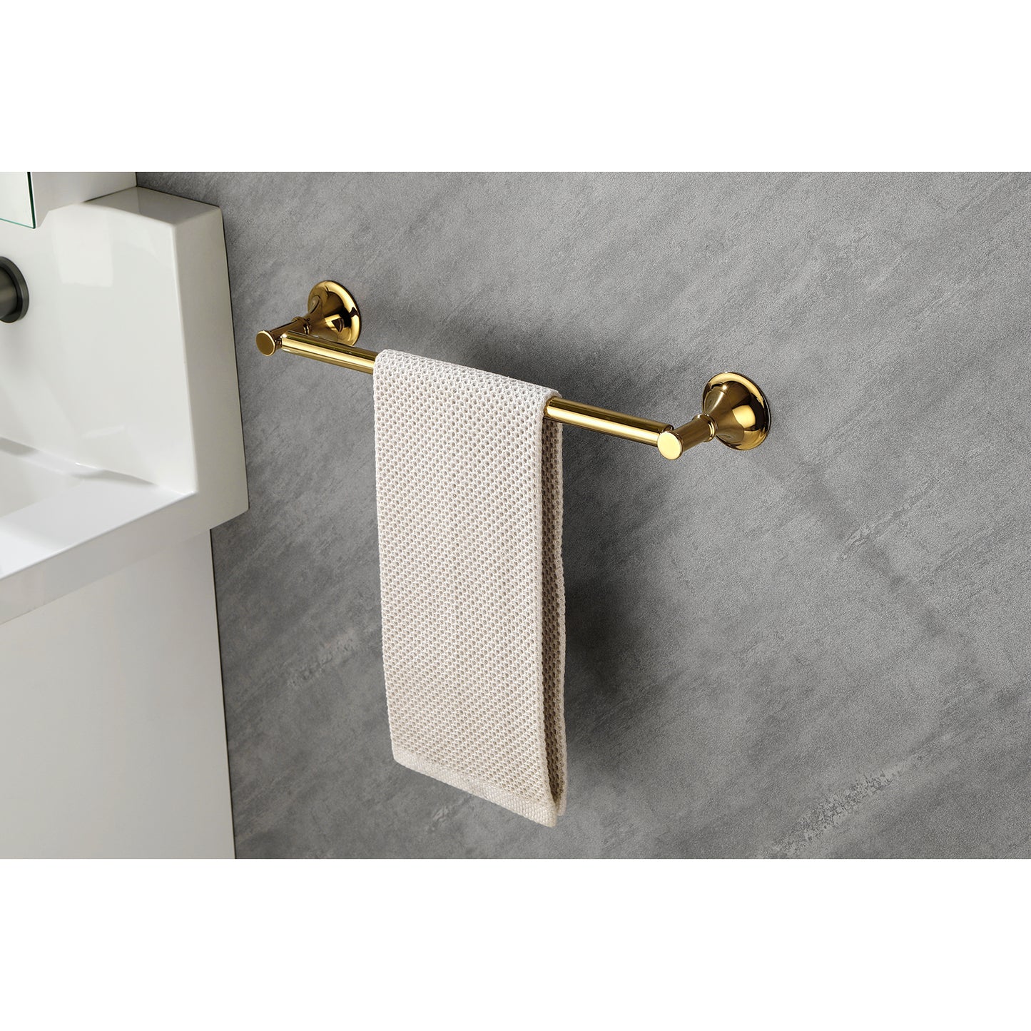 Polished brass towel bar with beige textured towel