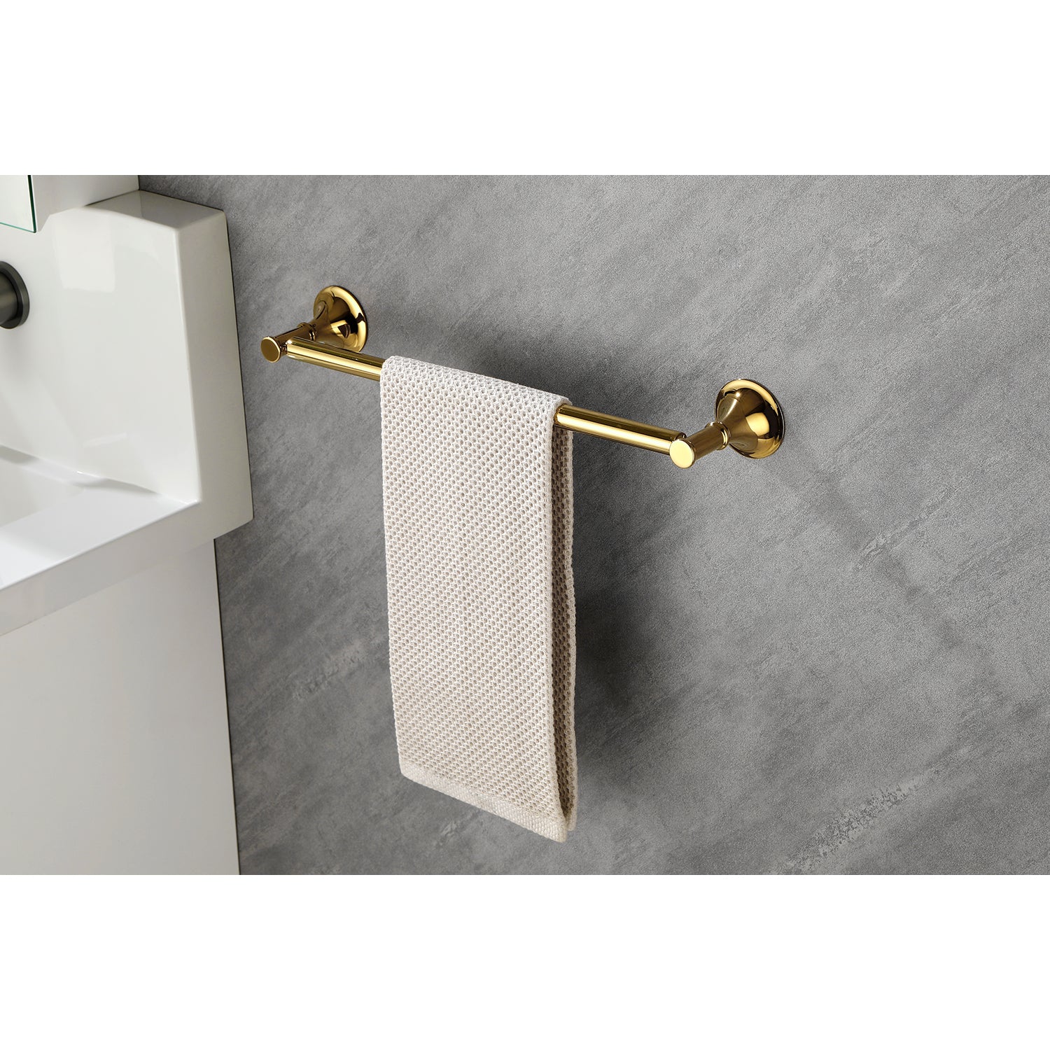 Polished brass towel bar with beige textured towel