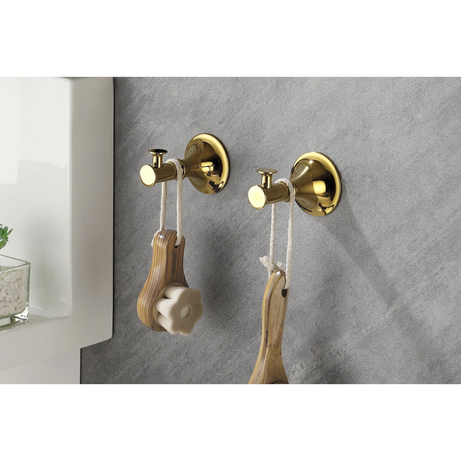 Golden wall hook for hanging bathroom accessories