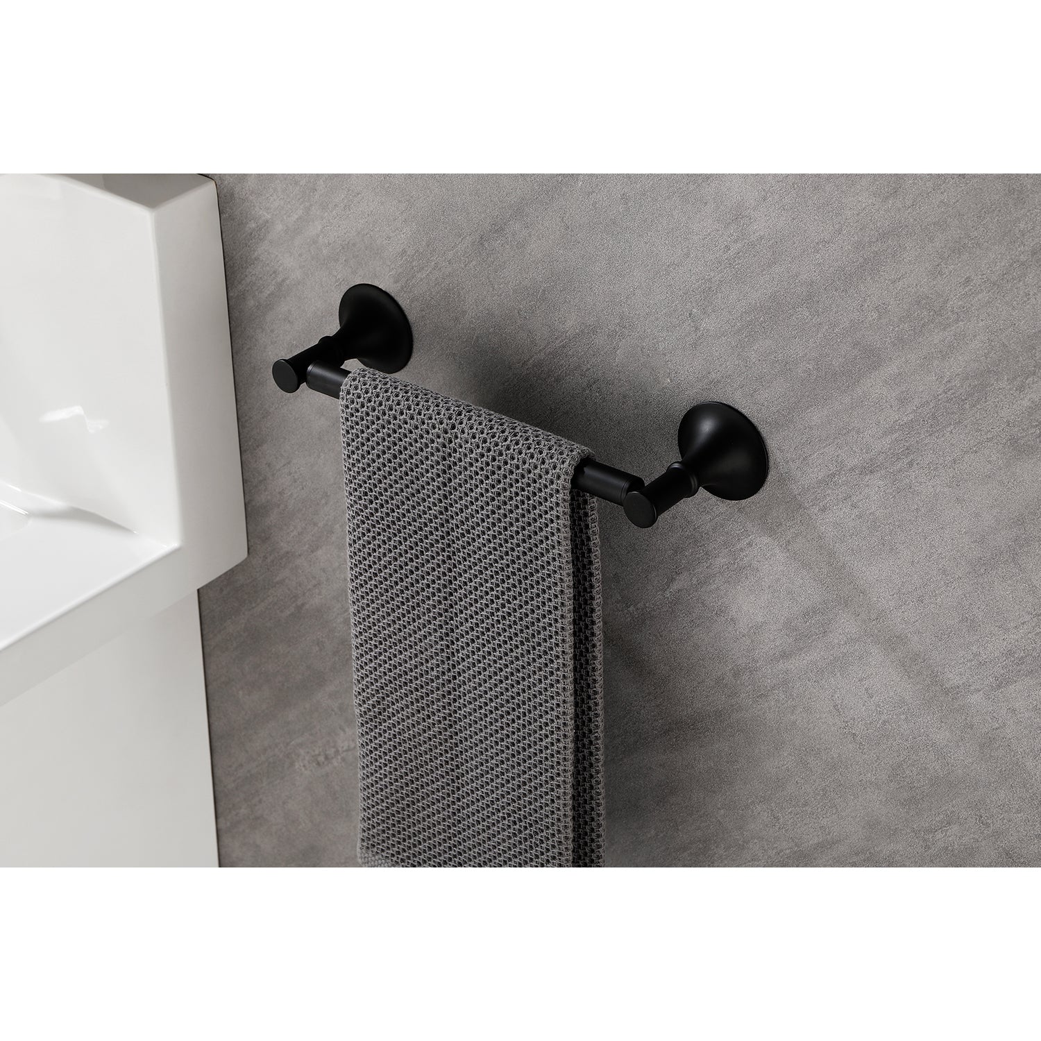 Matte black towel bar with a single bar and a textured grey towel