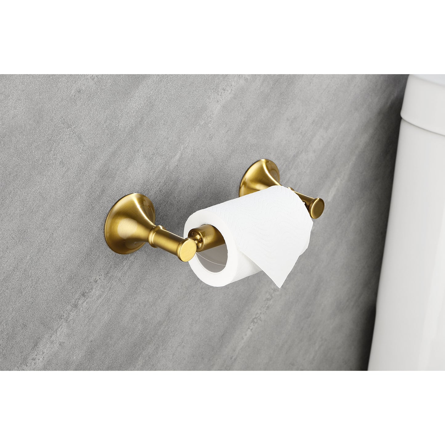 Antique brass toilet paper holder with a single roll mounted on a grey textured wall