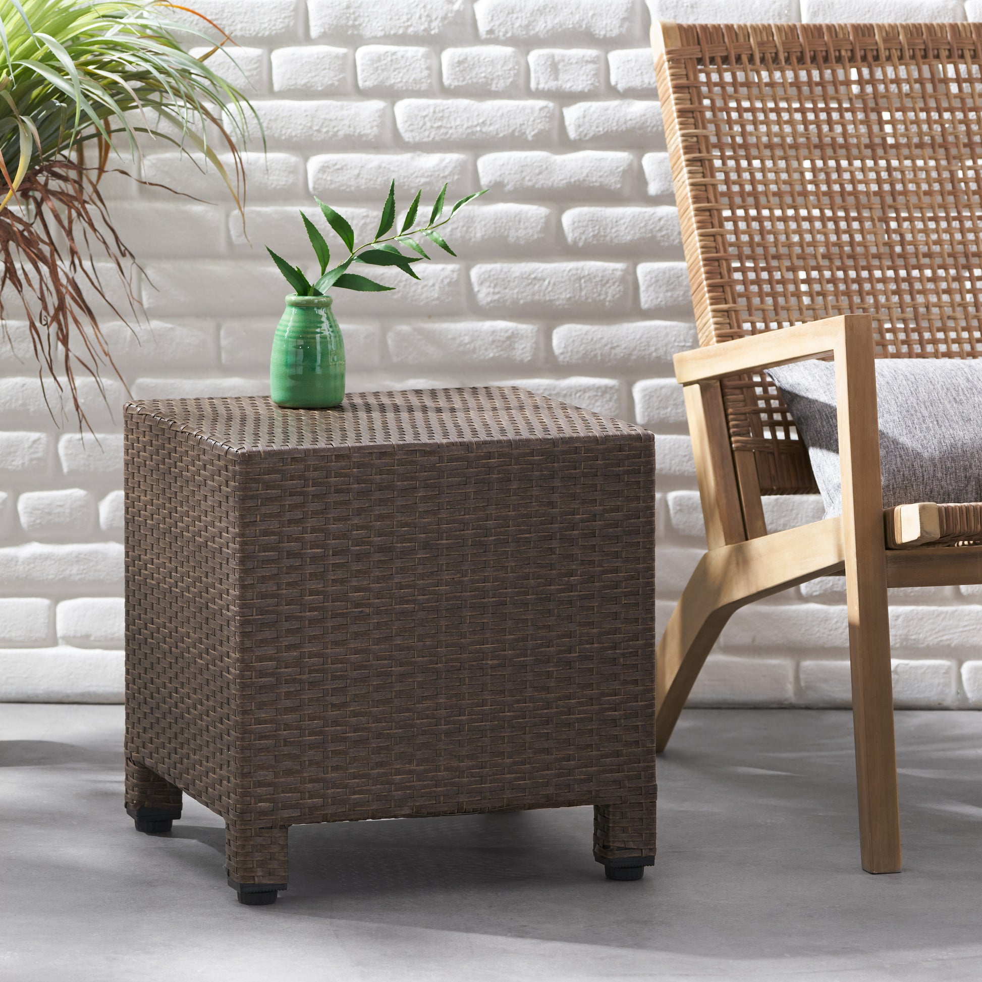 Brown wicker patio end table with a textured finish and cube design