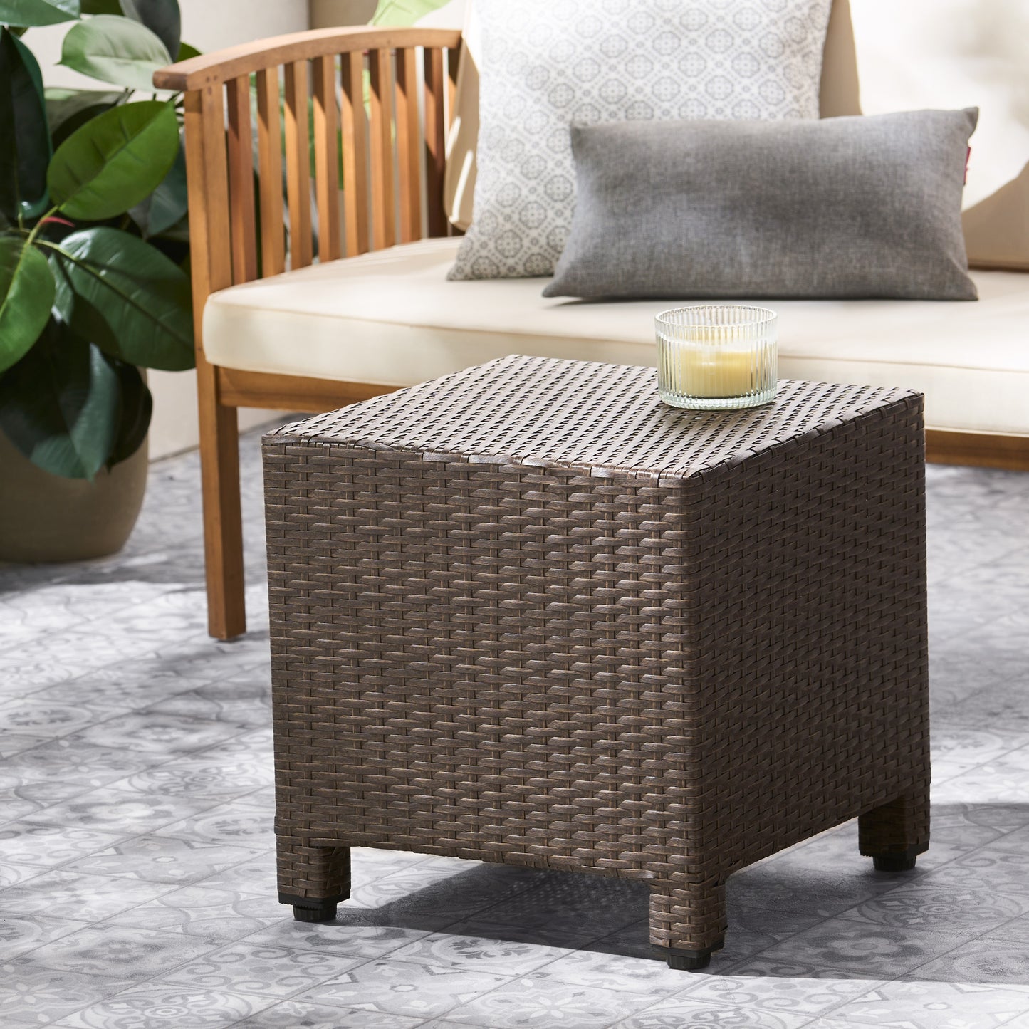 Brown wicker patio end table with a woven texture and compact design