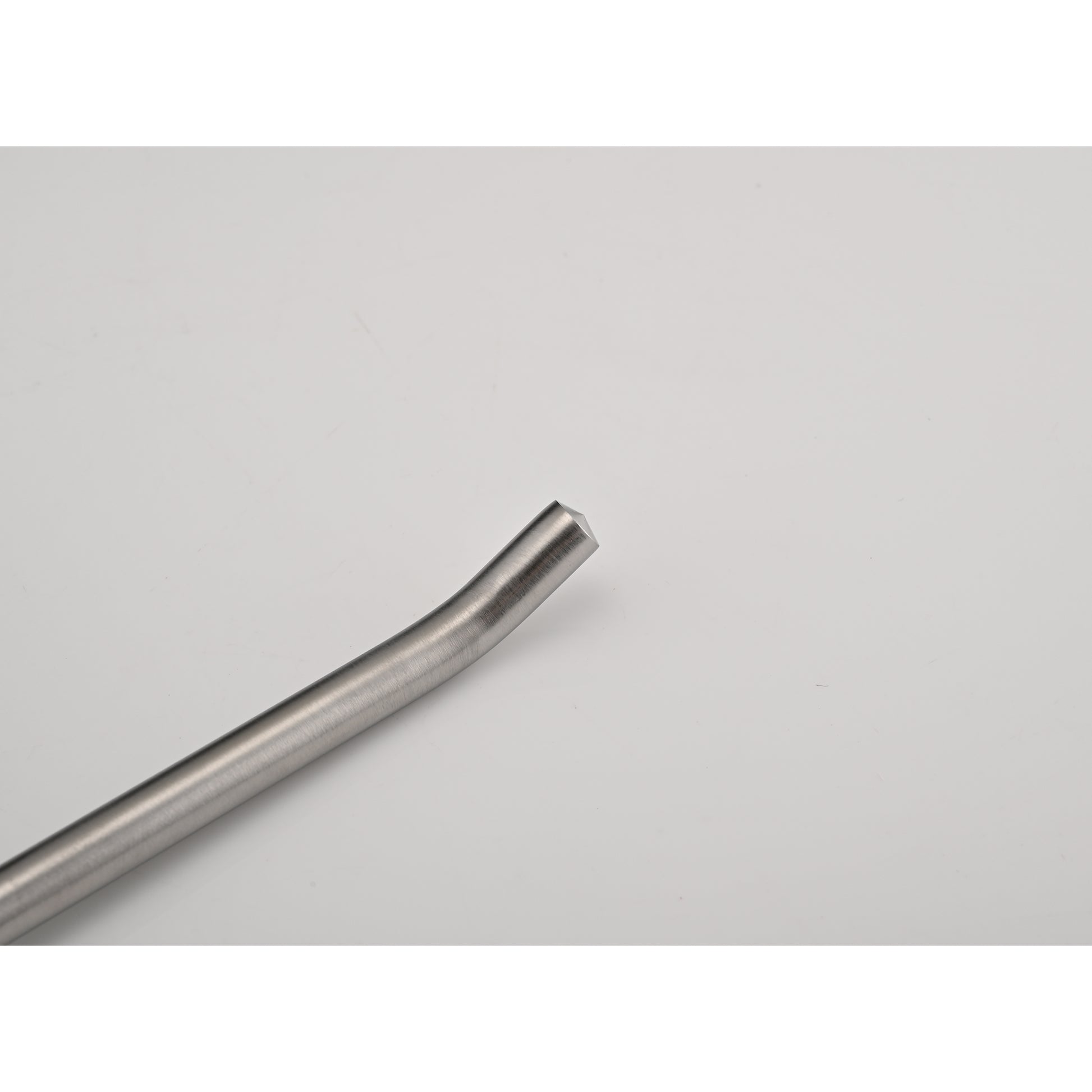 Brushed stainless steel coffee tamper with angled handle for espresso preparation