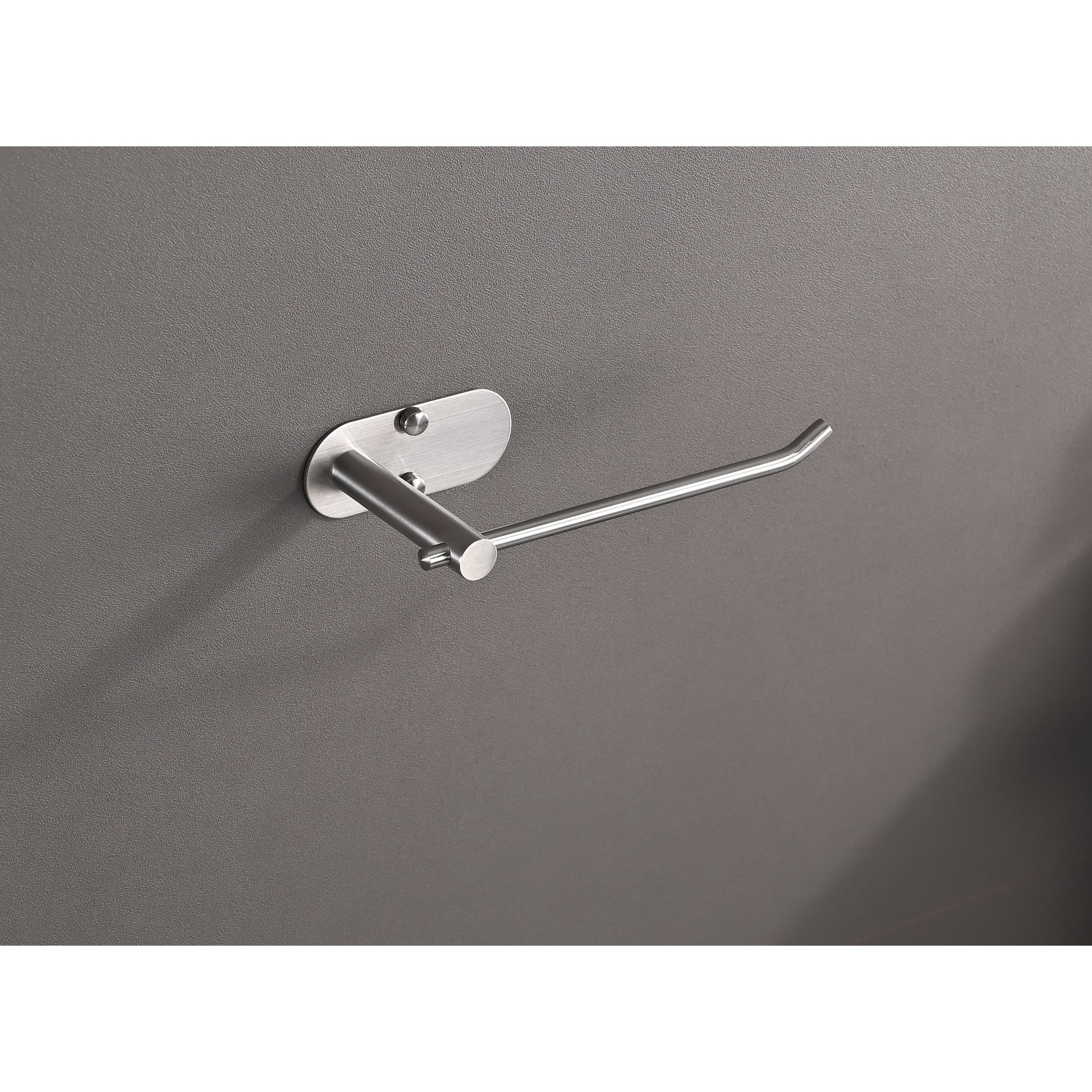 Brushed nickel toilet paper holder mounted on a gray textured wall