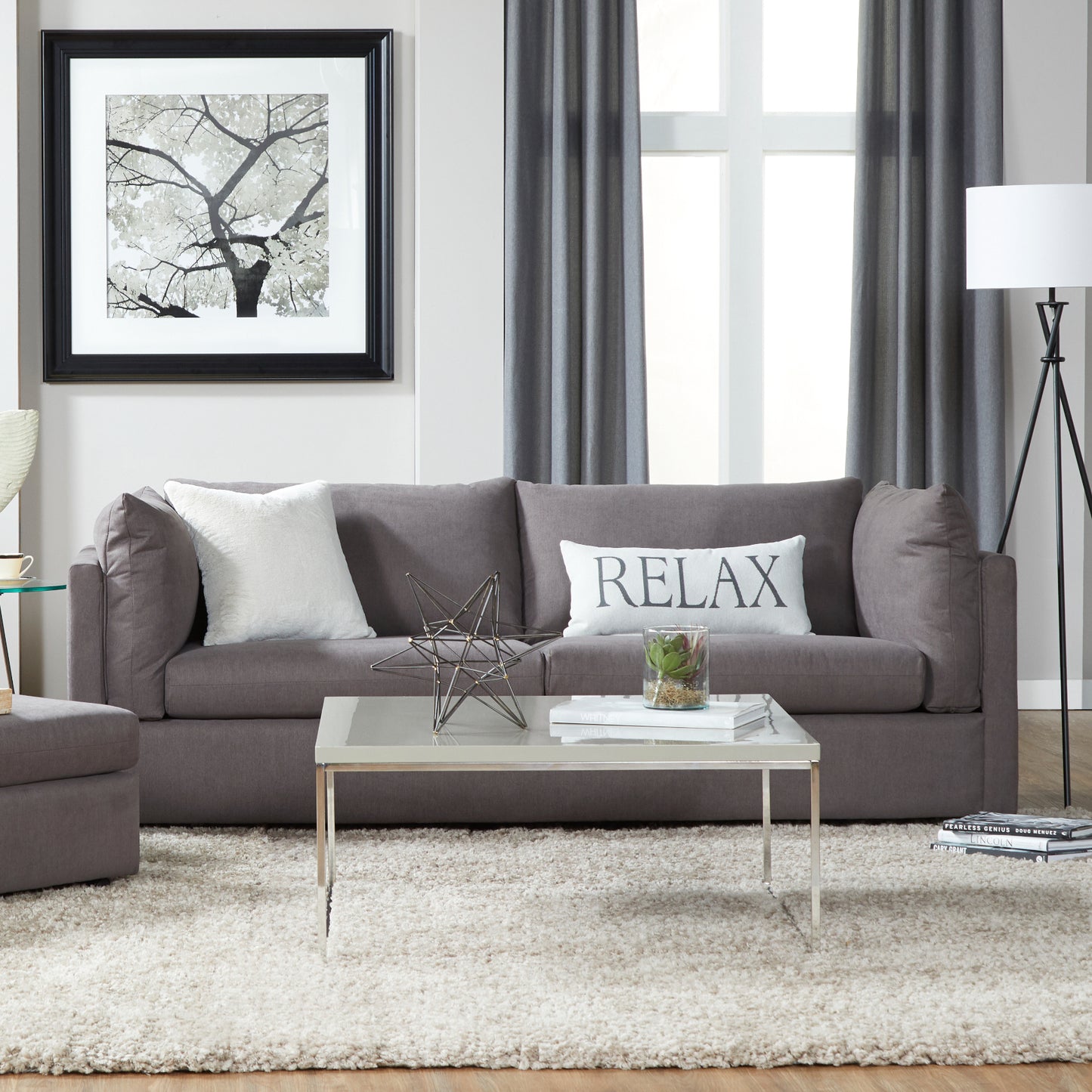 Comfortable taupe fabric sofa with plush throw pillows and modern decor