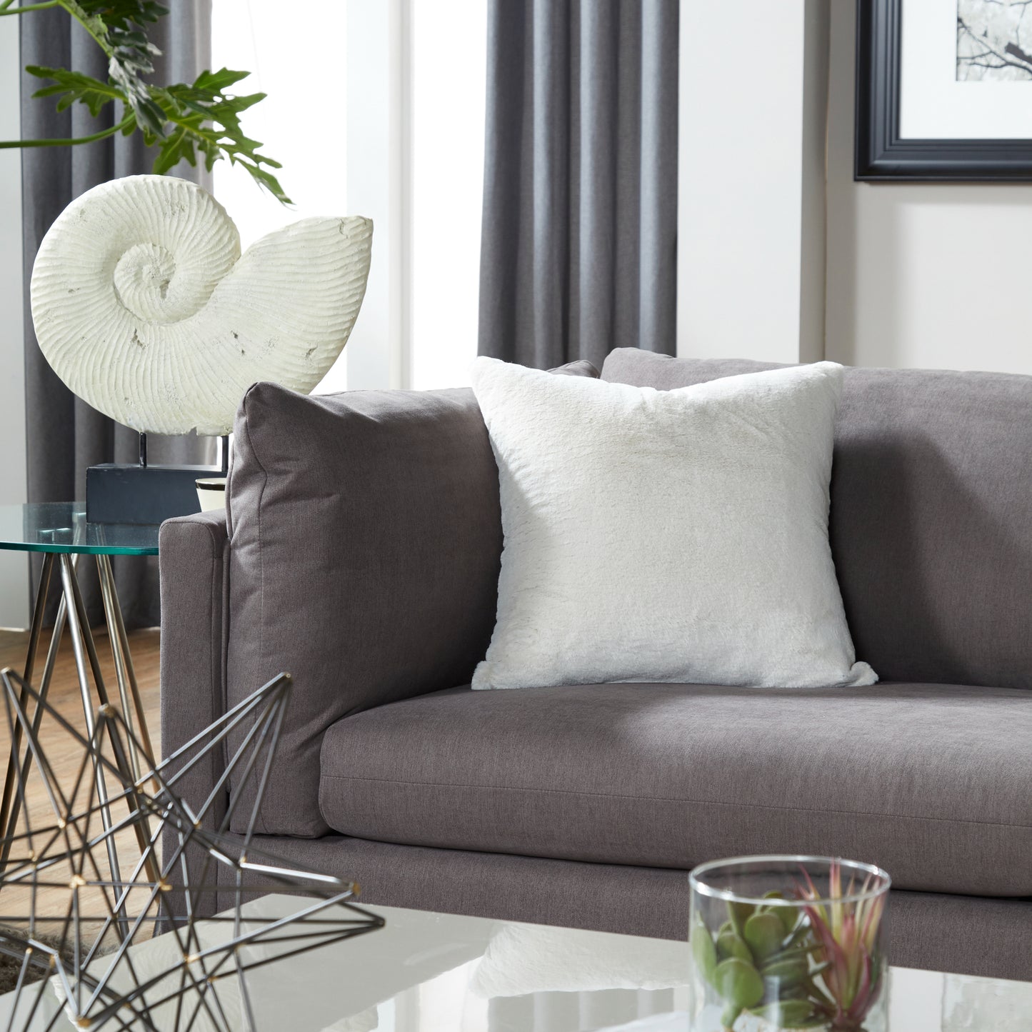 Faux fur throw pillow in bright white perfect for adding cozy texture to your sofa