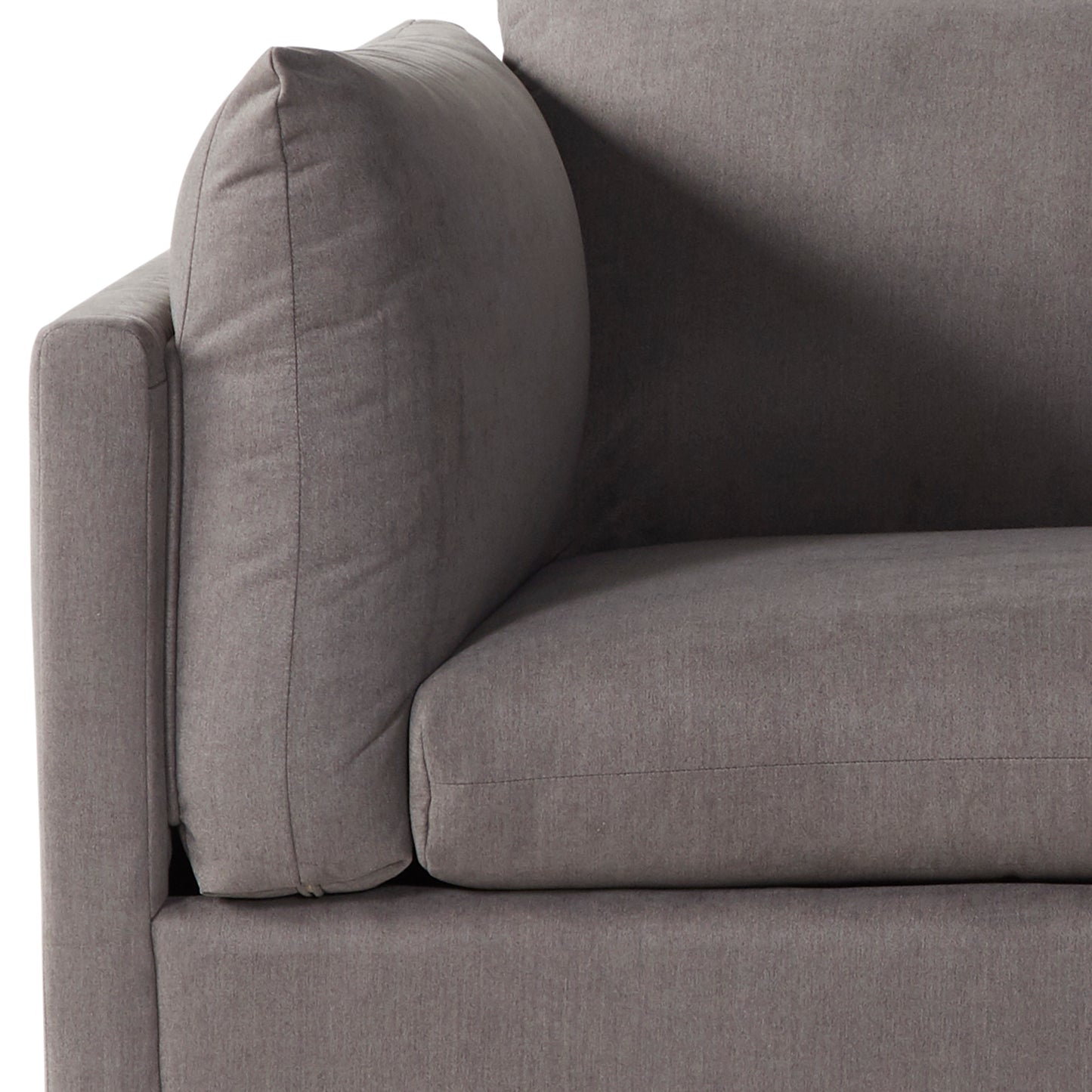 Closeup of a plush grey fabric sofa armrest with textured detail