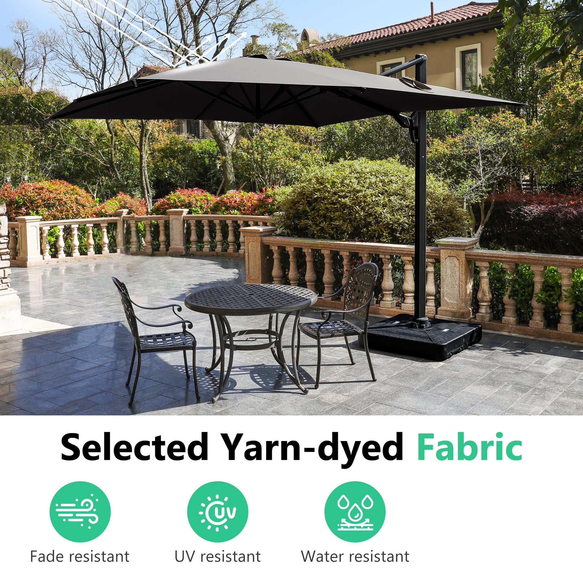 Large black cantilever patio umbrella providing shade over an outdoor seating area with a round metal table and chairs