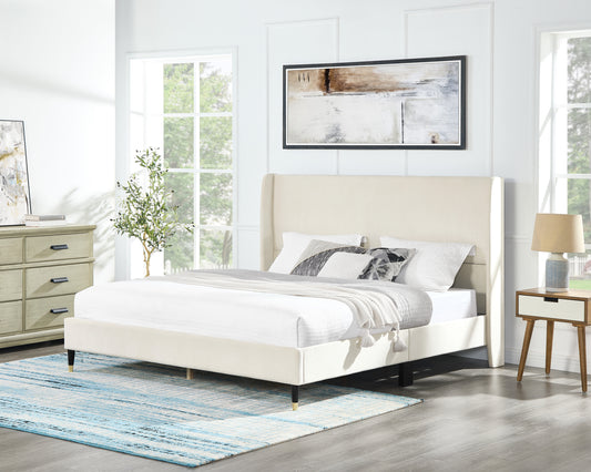 Cream velvet wingback bed frame with plush pillows and a textured throw Perfect for a modern bedroom