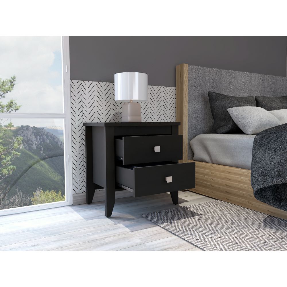 Black twodrawer nightstand with silver hardware next to a bed