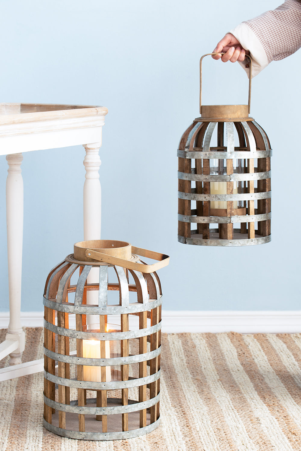 Rustic wooden and metal lantern with a wooden handle perfect for rustic home decor