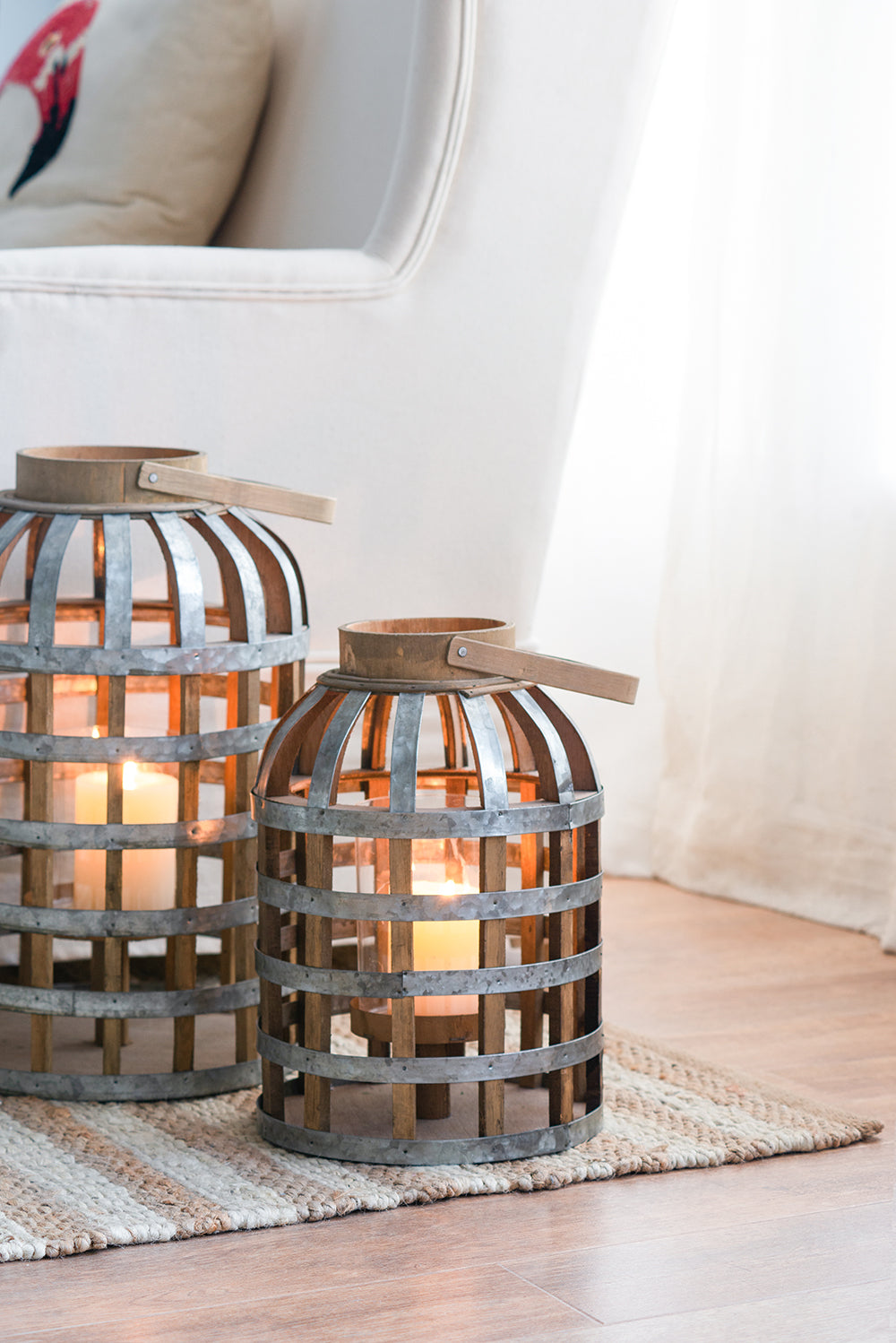 Rustic metal and wood lantern with glowing candle