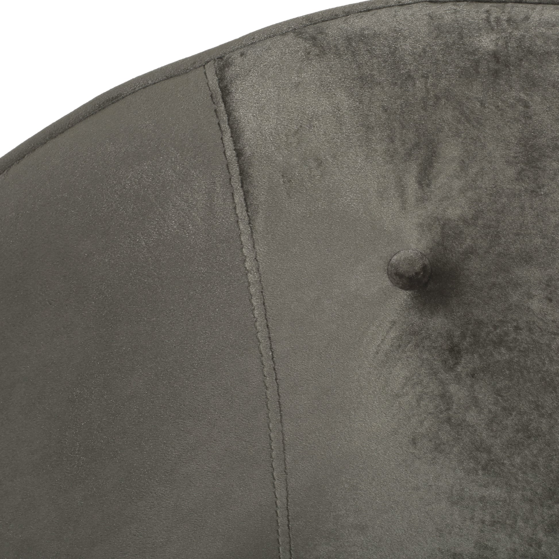 Dark grey velvet tufted accent chair back detail with button tufting