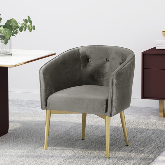 Grey velvet accent chair with gold legs and tufted backrest