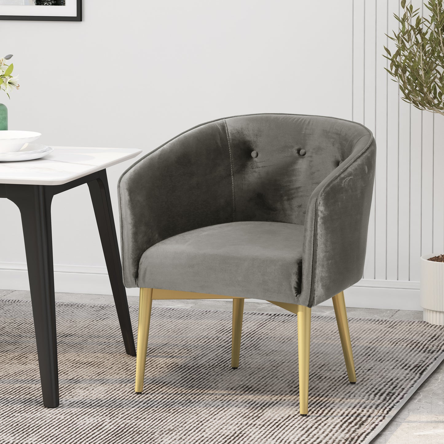 Comfortable grey velvet accent chair with elegant gold metal legs perfect for a modern living room