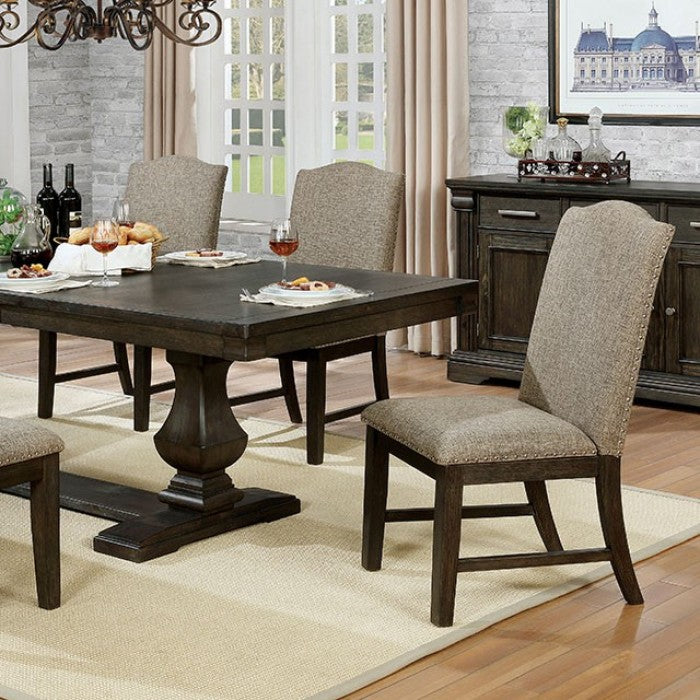 Dark wood pedestal dining table with upholstered chairs