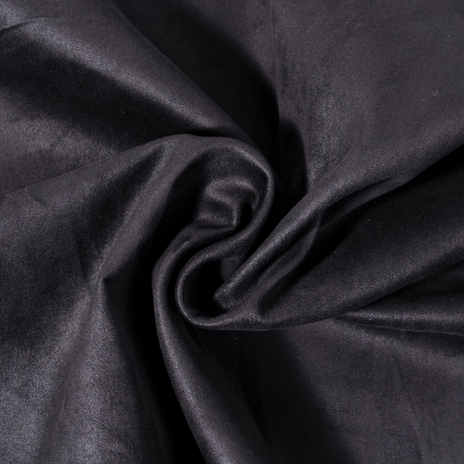 Closeup of black faux suede fabric texture