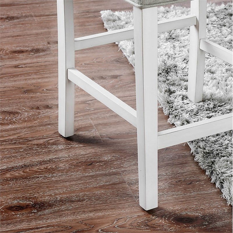 White wooden counter stool legs on a wood floor