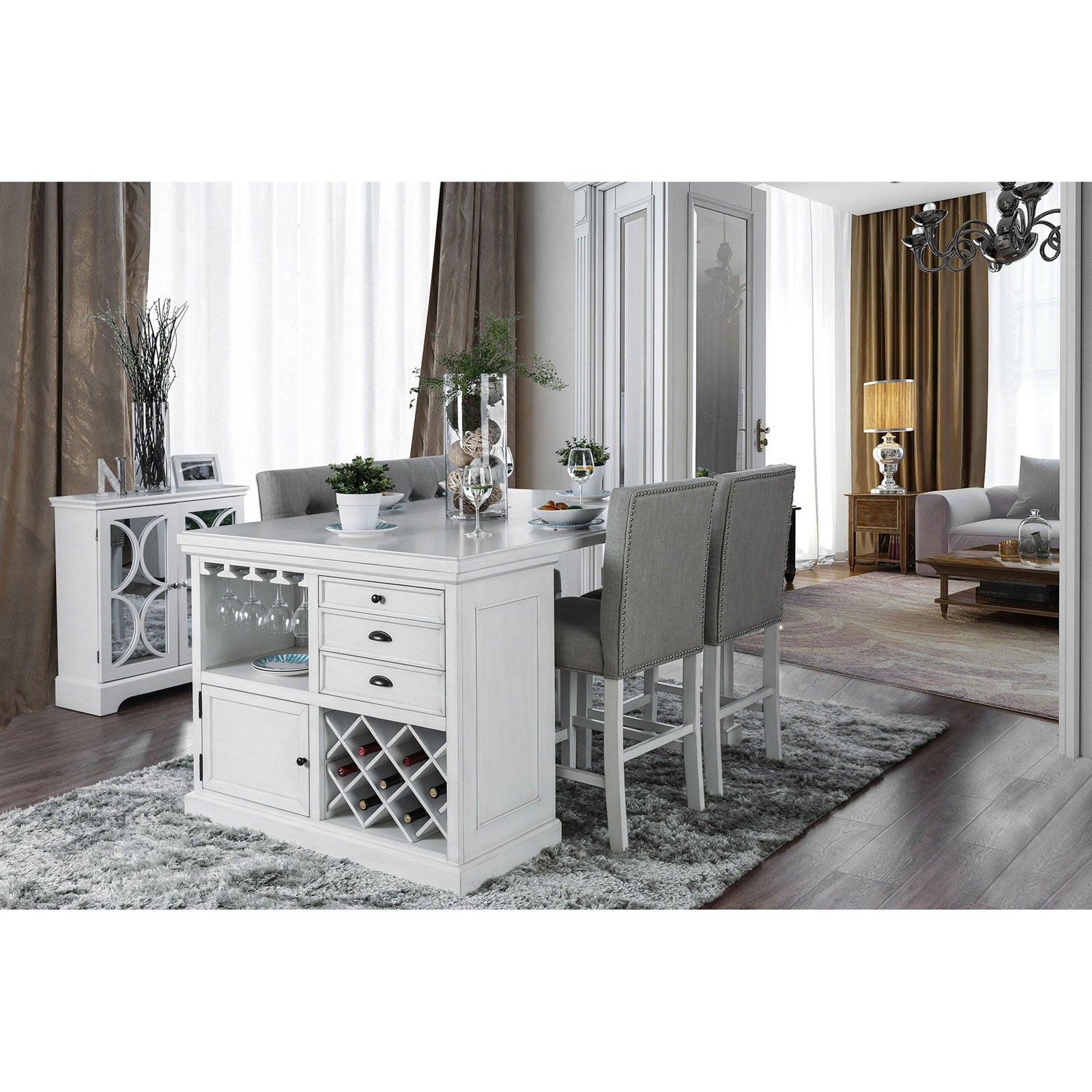 White kitchen island with wine rack and grey upholstered stools