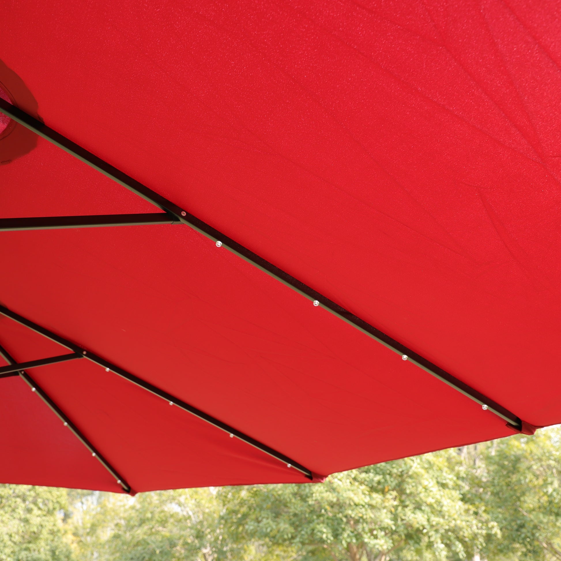 Red canvas patio umbrella canopy with black metal frame outdoor shade solution