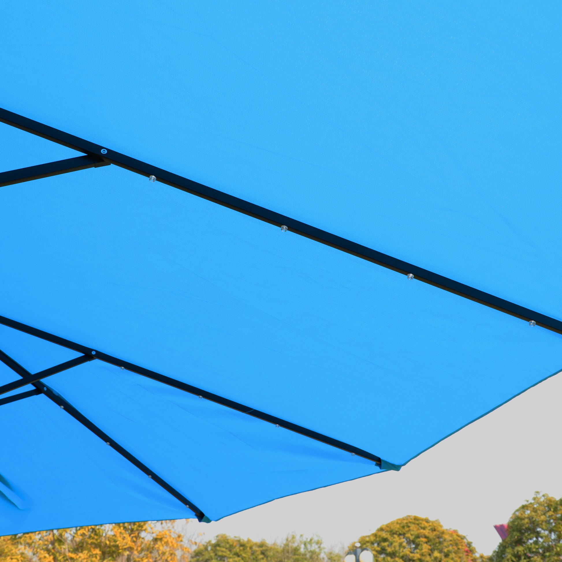 Blue patio umbrella canopy with black metal frame detail