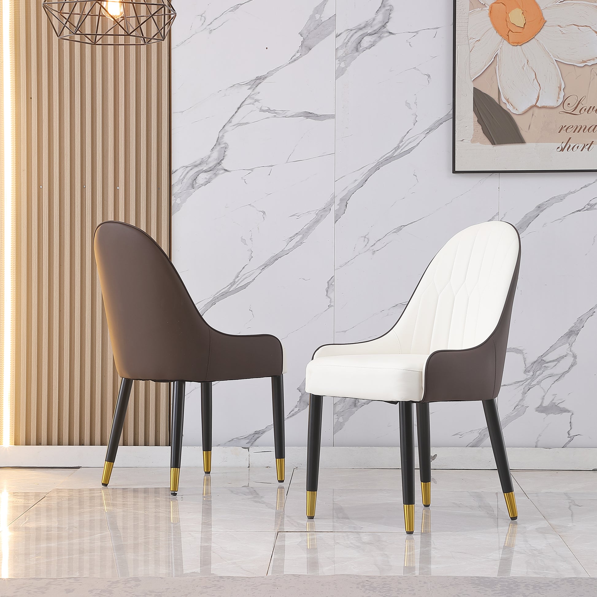 Modern accent chair in white PU leather with brown faux leather accents and gold tipped legs
