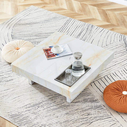 Square marble coffee table with modern design and gold veining