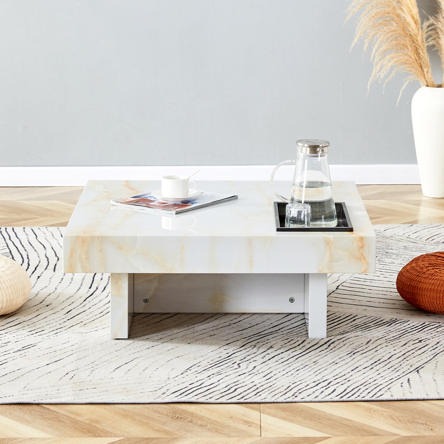 Square marble coffee table with veining featuring a builtin cooler for drinks