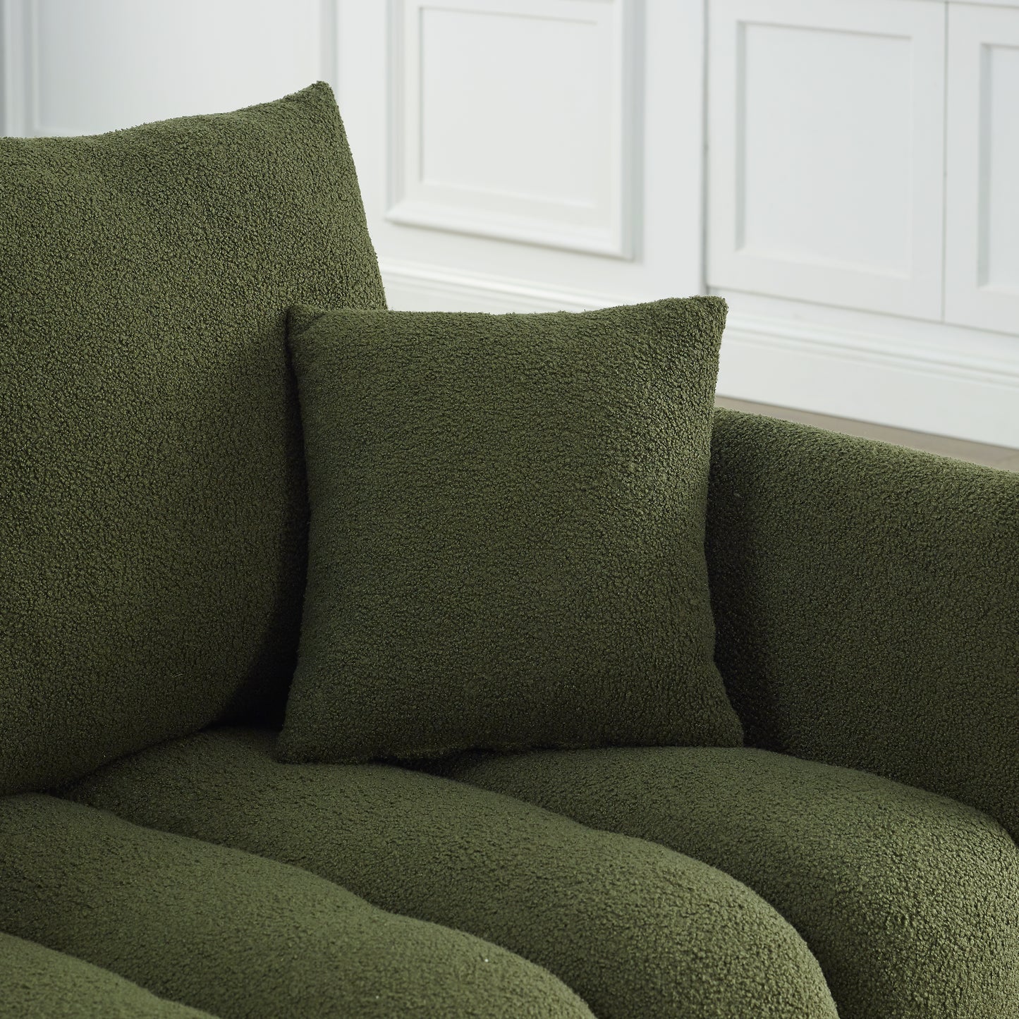 Plush green throw pillow with boucle texture for cozy living room decor